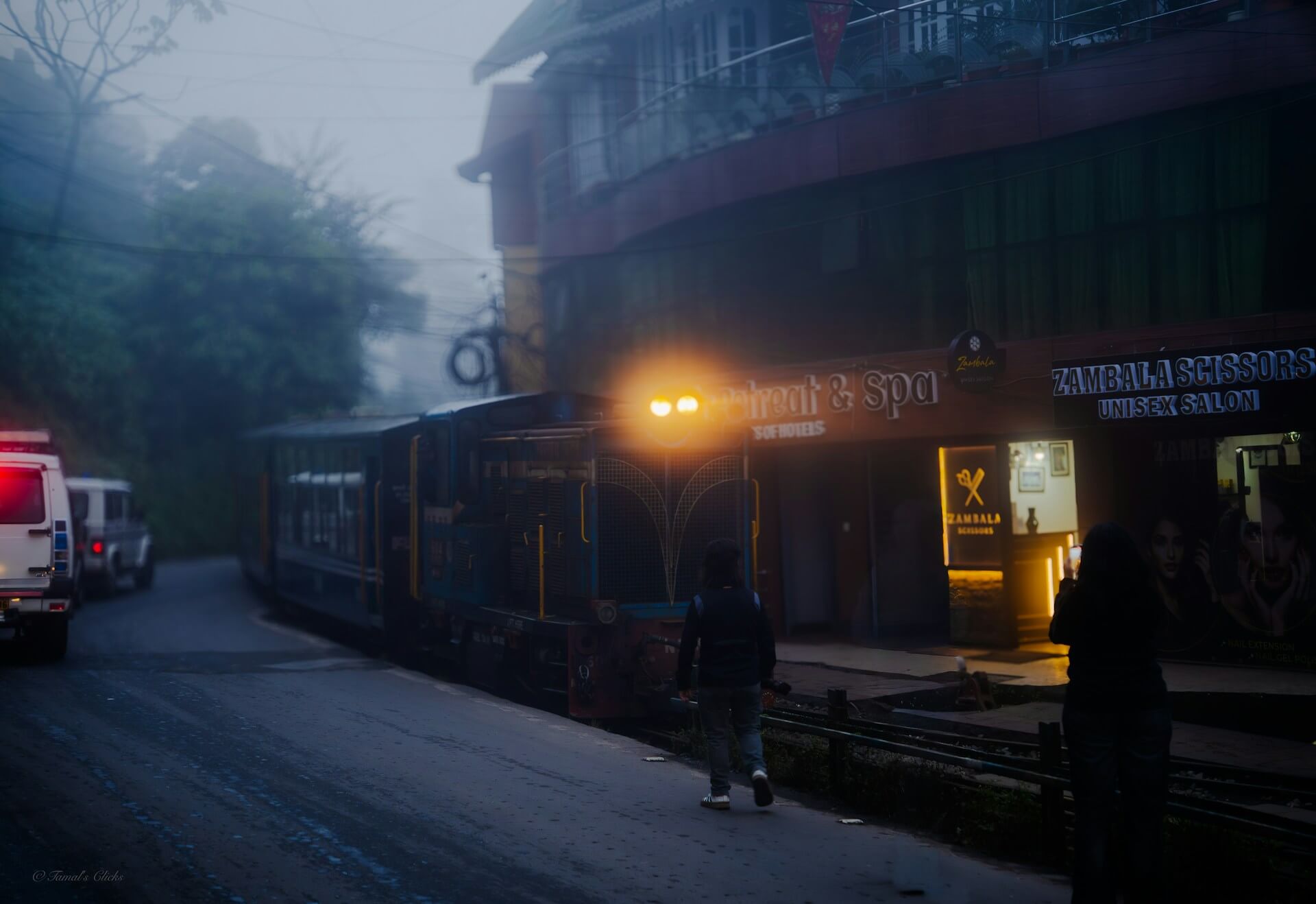 Darjeeling toy train on a misty town street